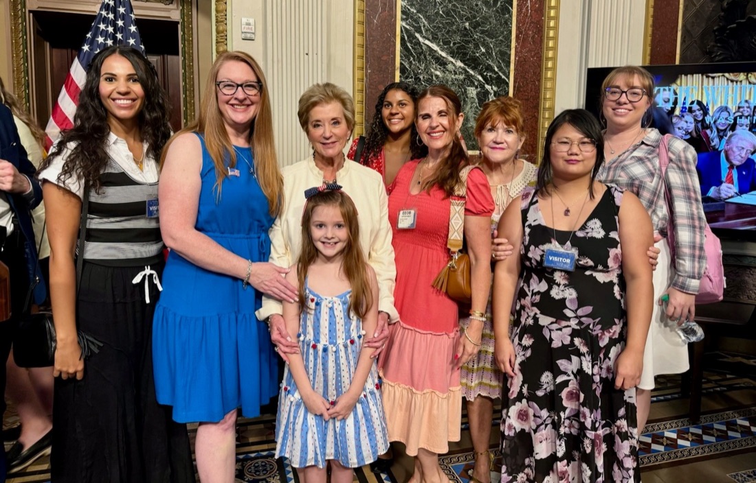 Moms for America members with a young girl at the White House