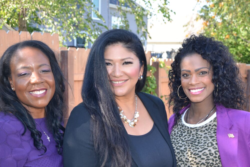 Three Moms for America members together outdoors